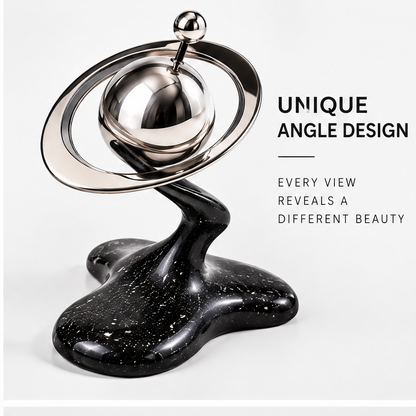 Unique Angle Design – every view reveals a different beauty, chrome orbit rings around metallic sphere shown from dramatic low angle