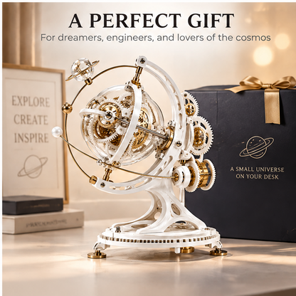 A Perfect Gift – For dreamers, engineers, and lovers of the cosmos – lifestyle shot with gift box showing A Small Universe on Your Desk text and Saturn icon – white gold gear orrery on warm desk surface with Explore Create Inspire art print in background