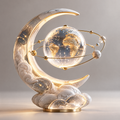 ORVAITOLEY® White Marble Crescent Moon Globe LED Sculpture – full product view on grey background, showing marble-finish crescent, crystal globe, gold orbit ring and warm LED glow